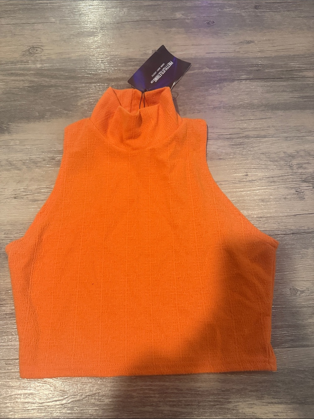 PrettyLittleThing Orange Ribbed High Neck Crop Top